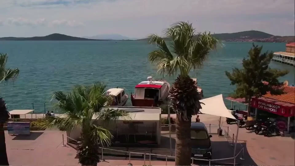 Ayvalık waterfront, a still from Protecting the Palms